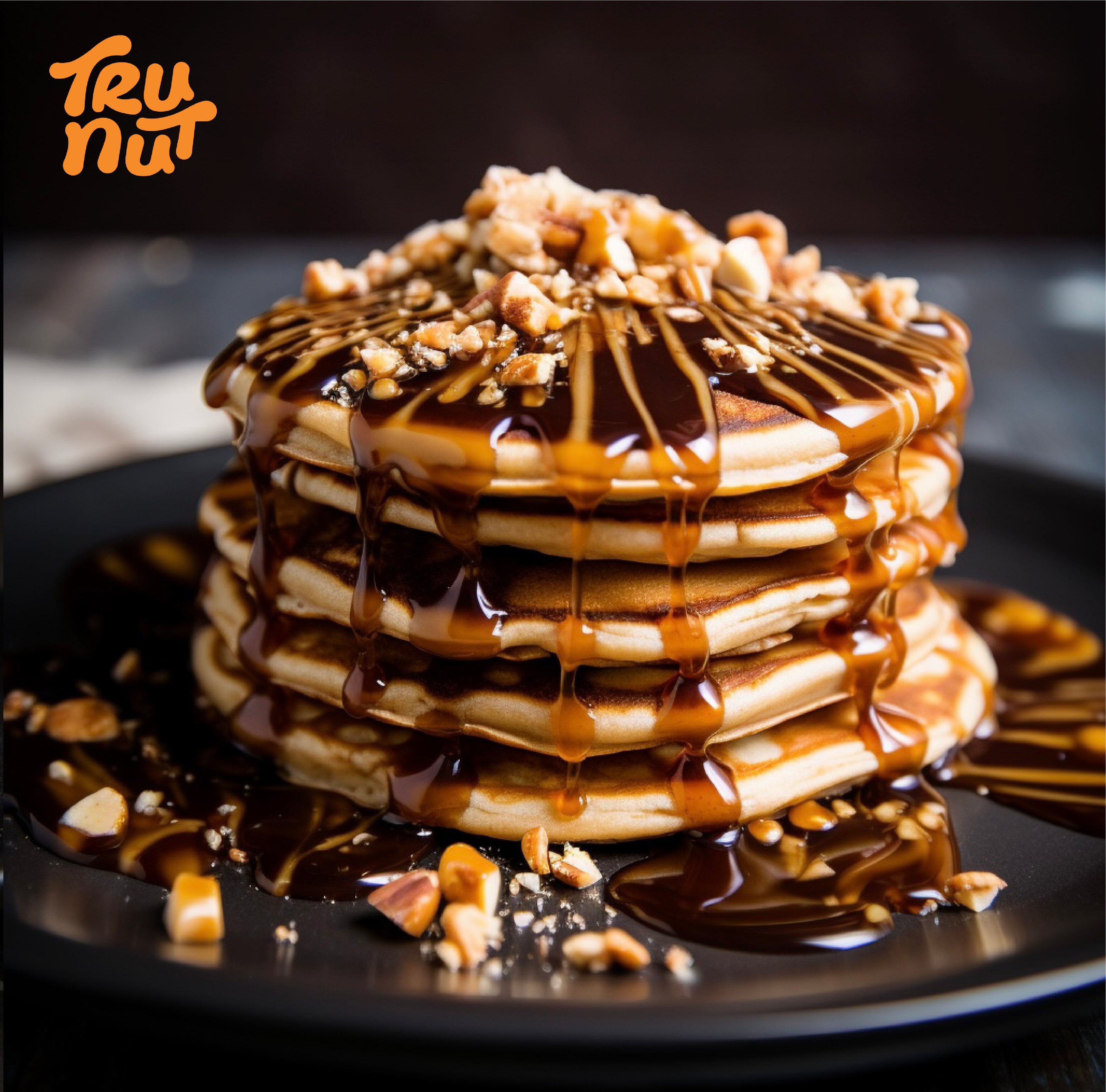 High-Protein Pancakes stacked with syrup drizzle - made with Tru-Nut Peanut Flour